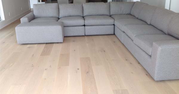 hardwood flooring with grey couch