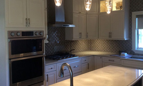 kitchen cabinets and marble countertops