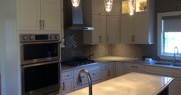 kitchen cabinets and marble countertops