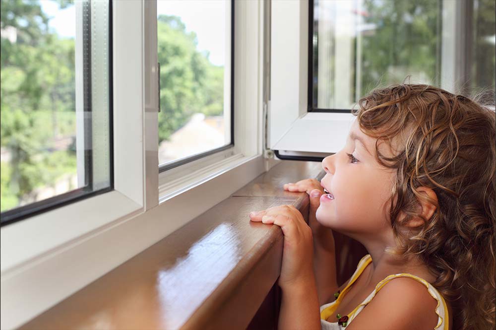 child looking out of window