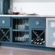 Blue modern kitchen cabinets with wine and glasses storage