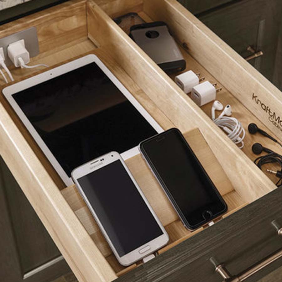 KraftMaid kitchen drawer storage idea for electronic device charging