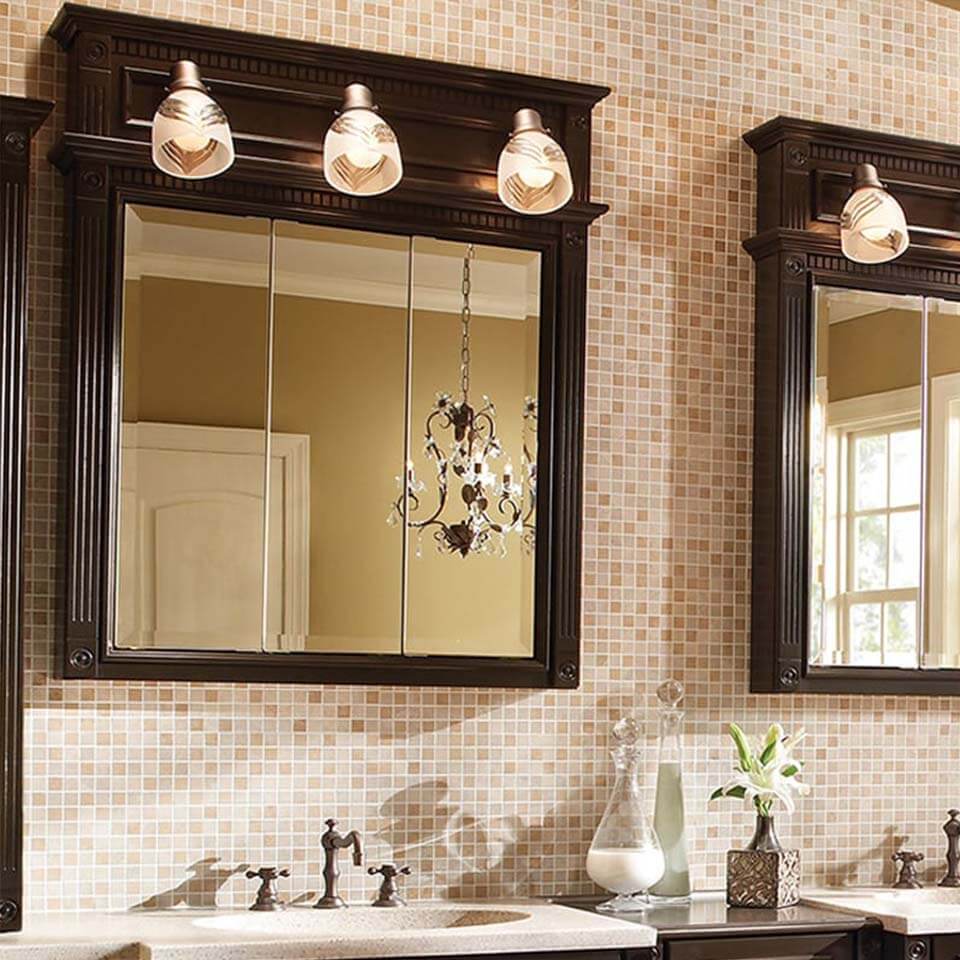 Dark wood over the sink bathroom cabinet with three mirrors and three vanity lights