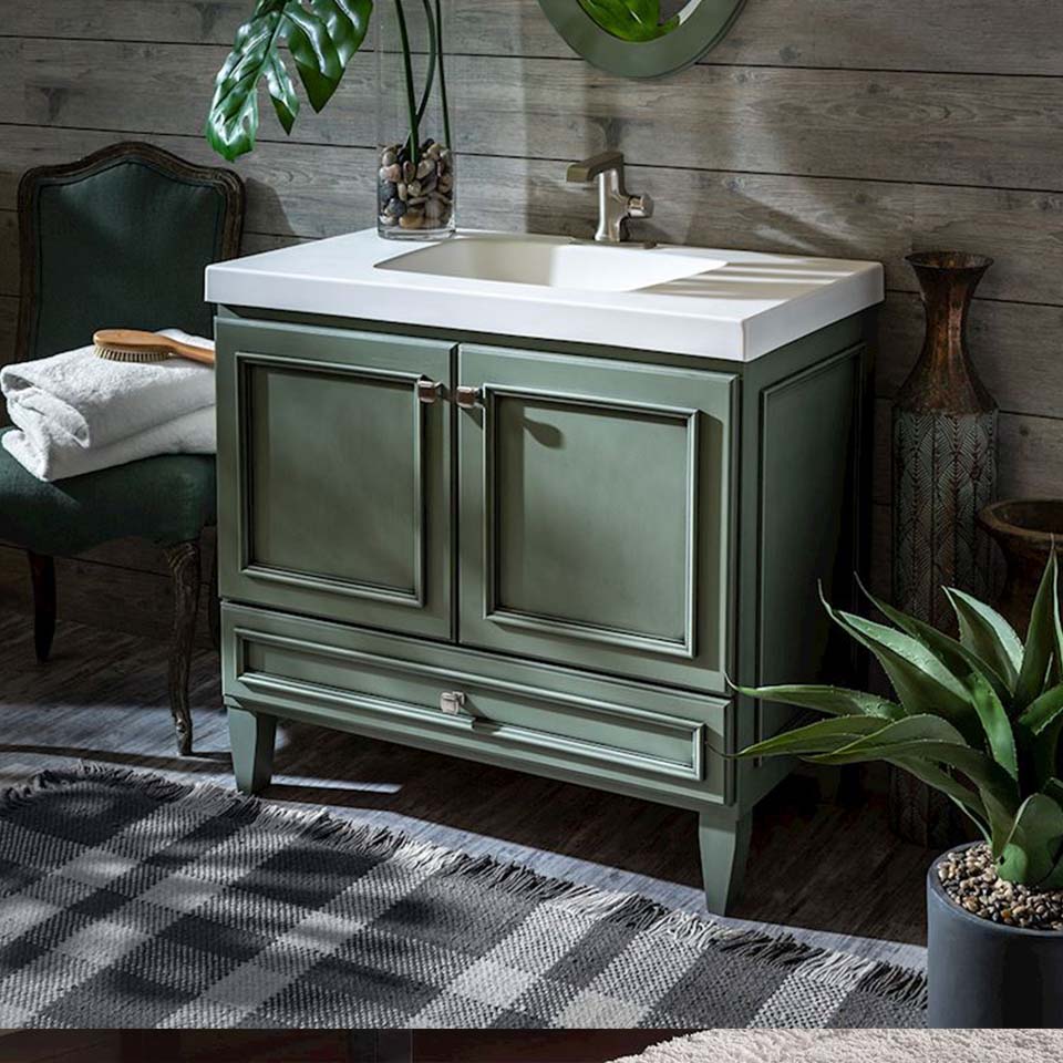 Light green bathroom vanity with white countertop.