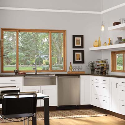 wood framed slider windows in white and grey kitchen
