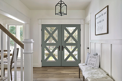 Green Thermatru barn-style wood and glass doors